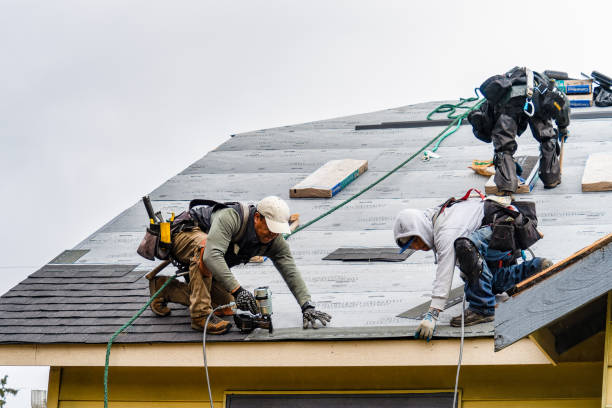 Professional Roofing technician working in Fayville, MA